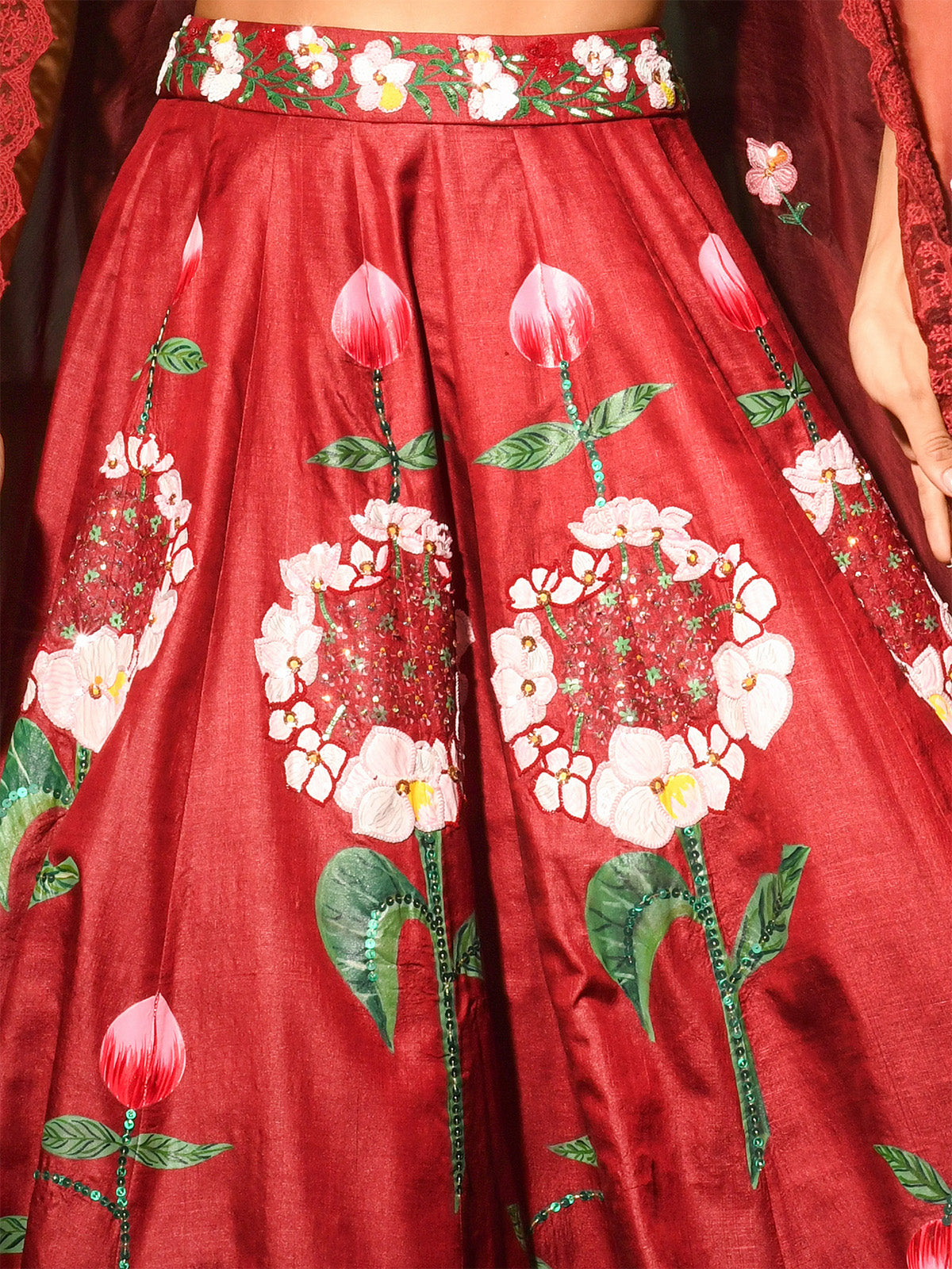 Woman wearing a red floral embroidered traditional outfit in an indoor setting.
Designer lehenga sets online shopping
Hand-embroidered lehenga for weddings
Luxury lehenga online India
Designer skirt sets with jacket
Lehenga with cape sets
Pre-draped lehenga sets
Mirror work lehenga
Organic fabric lehenga
Minimalist designer lehenga
Luxury lehenga Delhi Khan Market