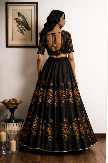 Woman wearing a black and gold embroidered traditional outfit in a room with decor elements.

Designer lehenga sets online shopping
Hand-embroidered lehenga for weddings
Luxury lehenga online India
Designer skirt sets with jacket
Lehenga with cape sets
Pre-draped lehenga sets
Mirror work lehenga
Organic fabric lehenga
Minimalist designer lehenga
Luxury lehenga Delhi 