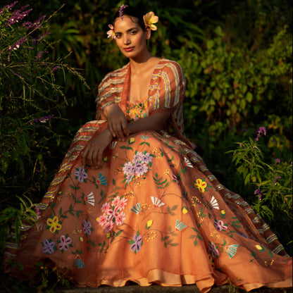 Baavli luxury designer store at Khan Market, New Delhi. Indian wedding, lehenge, Bride, Indian bride, bridesmaid. Orange skirt set with cape. Hand painted and embroidered.