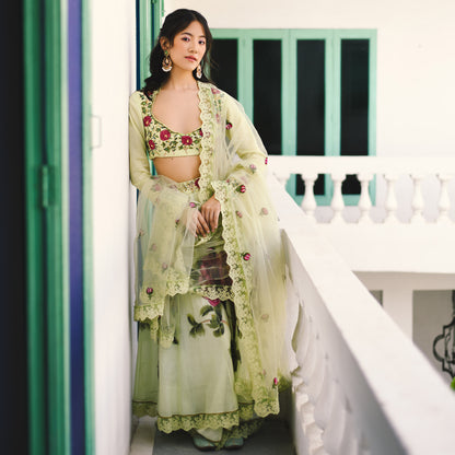 Woman in a light green traditional outfit with floral patterns standing on a staircase.

Baavli luxury designer store, New Delhi.
Indian wedding, lehenge, Bride, Indian bride, bridesmaid, Suit sets, Kaftan, sharara, jacket, kurta.
baavli launching its new collection, Hand painted, hand embroidered, Designer Label