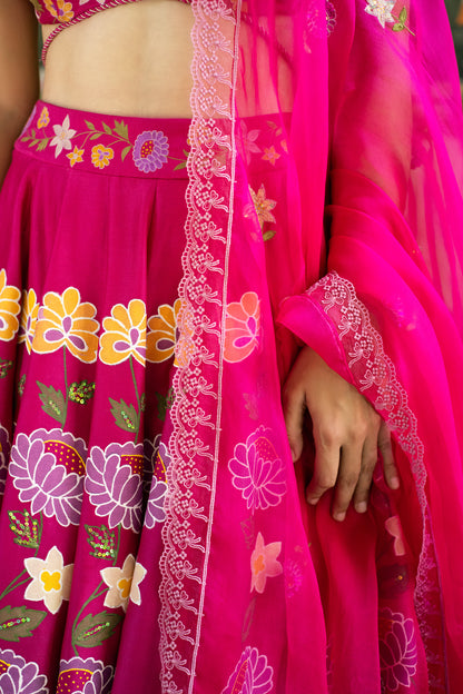 Pink fabric with floral patterns on a plain background

Woman in a bright pink traditional outfit with floral patterns standing in front of a blue door.

Baavli luxury designer store, New Delhi.
Indian wedding, lehenge, Bride, Indian bride, bridesmaid, Suit sets, Kaftan, sharara, jacket, kurta.
baavli launching its new collection,  Hand painted, hand embroidered, Designer Label