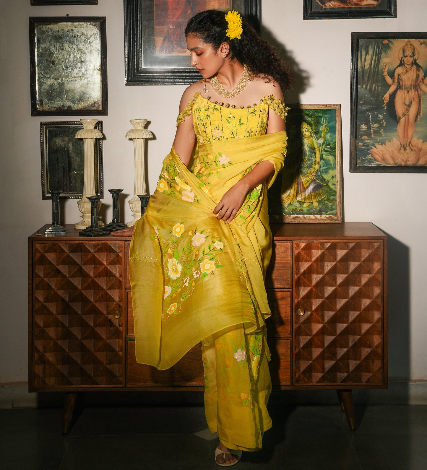 Woman in a yellow saree standing in front of a wooden cabinet with decorative items.

Baavli luxury designer store, New Delhi.
Indian wedding, lehenge, Bride, Indian bride, bridesmaid, Suit sets, Kaftan, sharara, jacket, kurta.
baavli launching its new collection, Hand painted, hand embroidered, Designer Label

Luxury, expensive, New Delhi. India, Kolkata, Chennai, Hyderabad. Business class Classy, southernly, elegant women. Elite class. 
