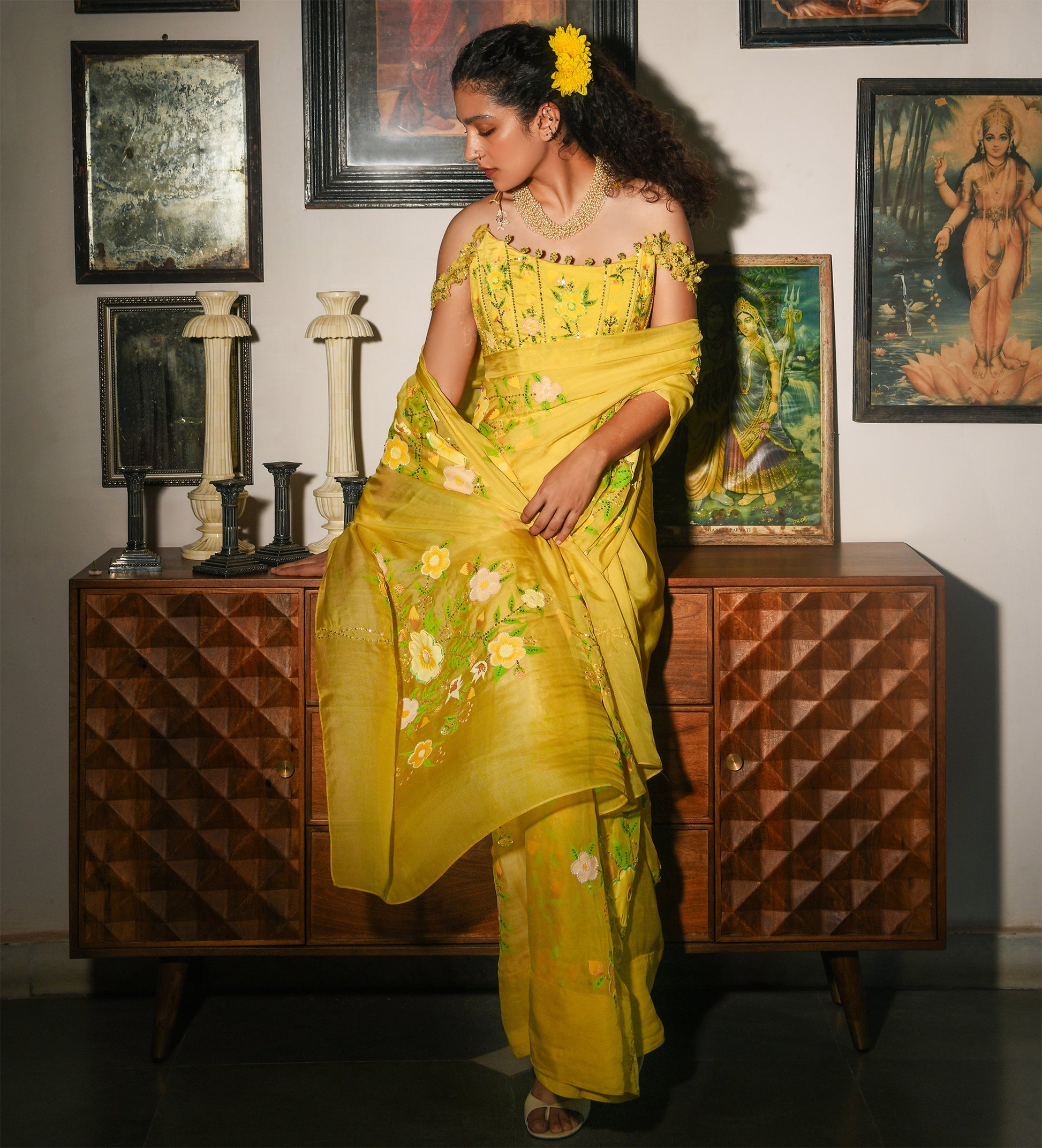 Woman in a yellow saree standing in front of a wooden cabinet with decorative items.

Baavli luxury designer store, New Delhi.
Indian wedding, lehenge, Bride, Indian bride, bridesmaid, Suit sets, Kaftan, sharara, jacket, kurta.
baavli launching its new collection, Hand painted, hand embroidered, Designer Label

Luxury, expensive, New Delhi. India, Kolkata, Chennai, Hyderabad. Business class Classy, southernly, elegant women. Elite class. 