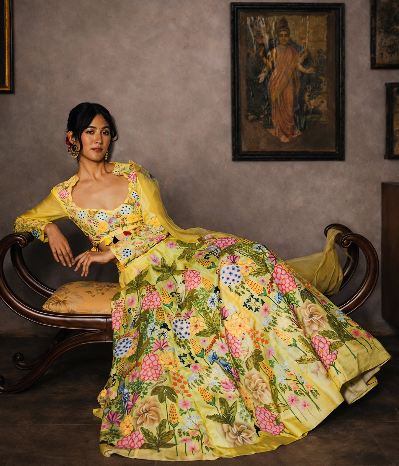 Woman in a yellow floral dress sitting on a wooden bench with a painting in the background.

● Designer lehenga sets online shopping
● Hand-embroidered lehenga for weddings
● Luxury lehenga online India
● Designer skirt sets with jacket
● Lehenga with cape sets
● Pre-draped lehenga sets
● Mirror work lehenga
● Organic fabric lehenga
● Minimalist designer lehenga
● Luxury lehenga Delhi Khan Market