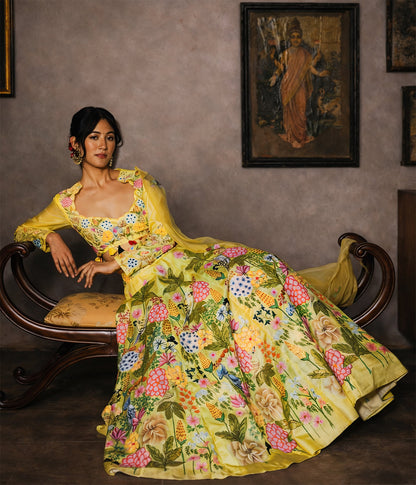 Woman in a yellow floral dress sitting on a wooden bench with a painting in the background.

● Designer lehenga sets online shopping
● Hand-embroidered lehenga for weddings
● Luxury lehenga online India
● Designer skirt sets with jacket
● Lehenga with cape sets
● Pre-draped lehenga sets
● Mirror work lehenga
● Organic fabric lehenga
● Minimalist designer lehenga
● Luxury lehenga Delhi Khan Market